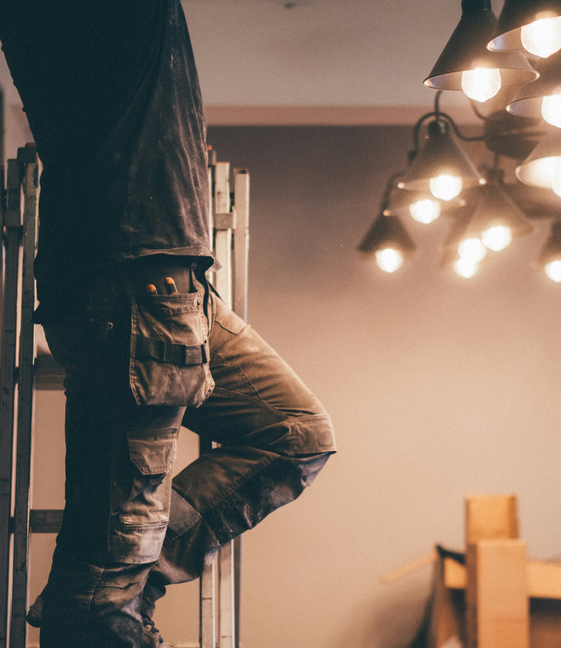 Man climbing up a ladder.
